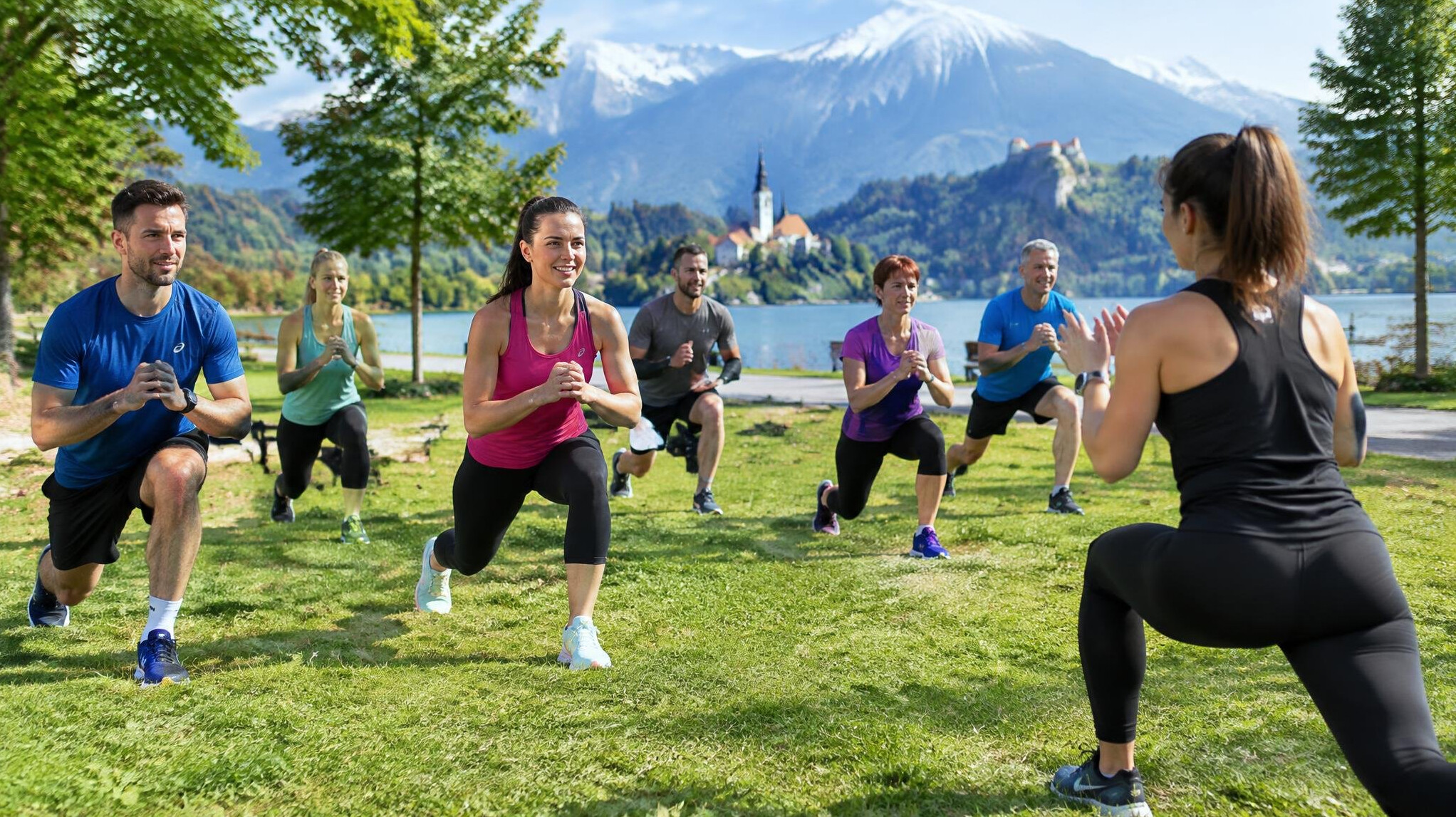 Group of people doing a guided outdoor workout session