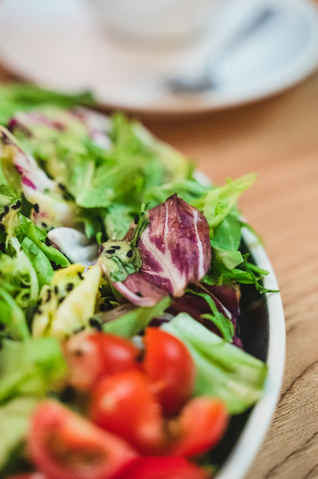 Close-up of fresh colorful vegetables arranged on a wooden table