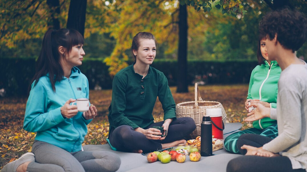 Small group of health coaches discussing a wellness program around a table